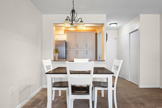 740 Weston Rd Unit 309-B, Hot Springs, AR 71913 - dining area with carpet floors, a chandelier, and baseboards