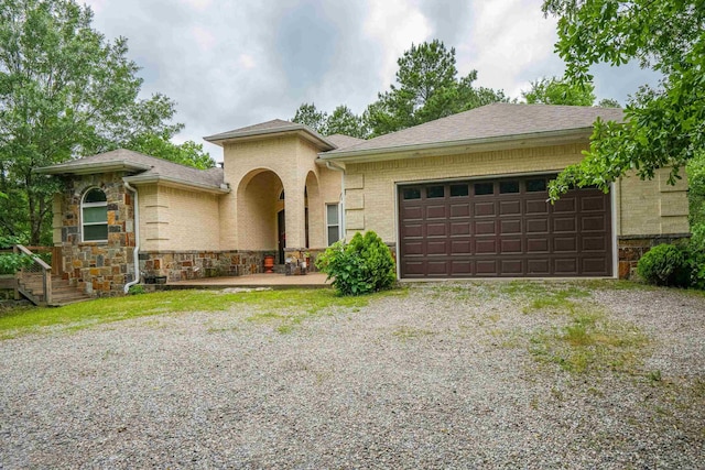 480 Shoat Trl, Hot Springs, AR 71913 - view of front of property with an attached garage, gravel driveway, stone siding, and roof with shingles