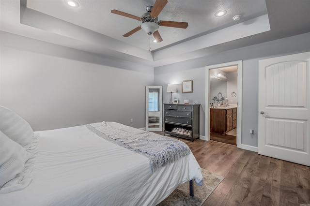 58 Eaglebrook Dr, Conway, AR 72032 - bedroom featuring a tray ceiling, wood finished floors, baseboards, recessed lighting, and ceiling fan