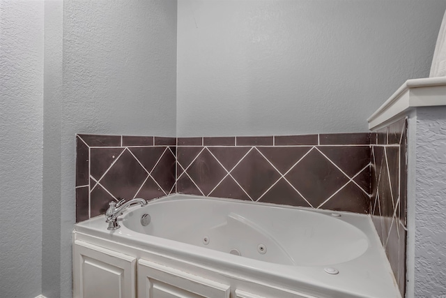 58 Eaglebrook Dr, Conway, AR 72032 - bathroom with a textured wall and a jetted tub