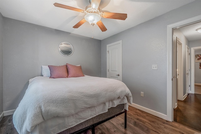 58 Eaglebrook Dr, Conway, AR 72032 - bedroom with baseboards, wood finished floors, and ceiling fan
