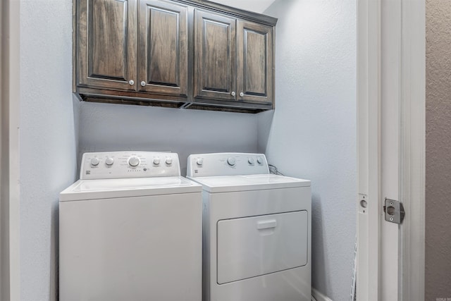 58 Eaglebrook Dr, Conway, AR 72032 - laundry room with separate washer and dryer, cabinet space, and a textured wall
