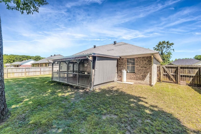 58 Eaglebrook Dr, Conway, AR 72032 - back of house with brick siding and a sunroom