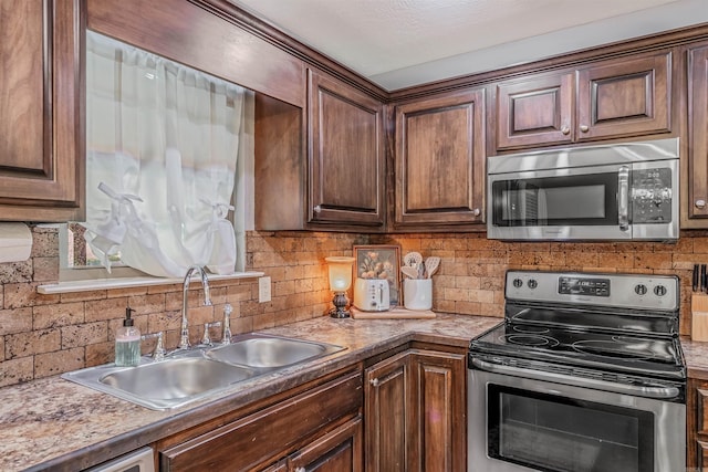58 Eaglebrook Dr, Conway, AR 72032 - kitchen featuring stainless steel appliances, a sink, and tasteful backsplash