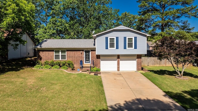 2 Timber Ridge Ct, Little Rock, AR 72211 - tri-level home with brick siding, a garage, driveway, and roof with shingles