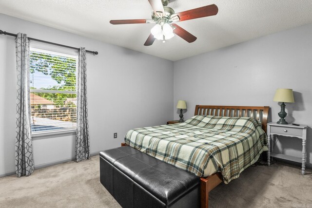 2 Timber Ridge Ct, Little Rock, AR 72211 - bedroom with light colored carpet, a ceiling fan, a textured ceiling, and baseboards