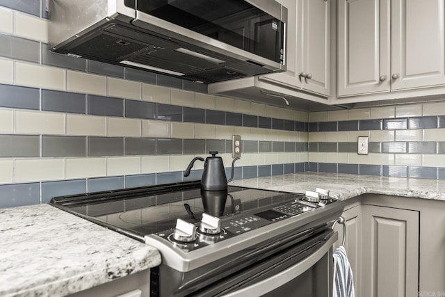 2 Timber Ridge Ct, Little Rock, AR 72211 - kitchen with stainless steel appliances, backsplash, light stone countertops, and white cabinets