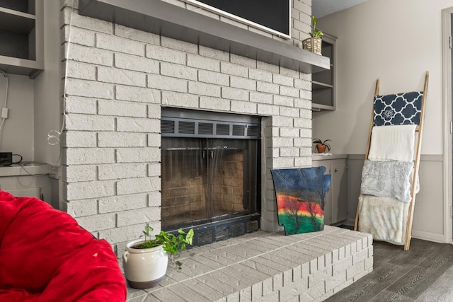 2 Timber Ridge Ct, Little Rock, AR 72211 - detailed view of a brick fireplace and wood finished floors
