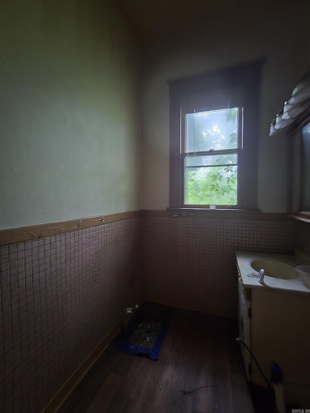 1609 W Charles Bussey Ave, Little Rock, AR 72202 - bathroom with wood finished floors, vanity, and a wainscoted wall
