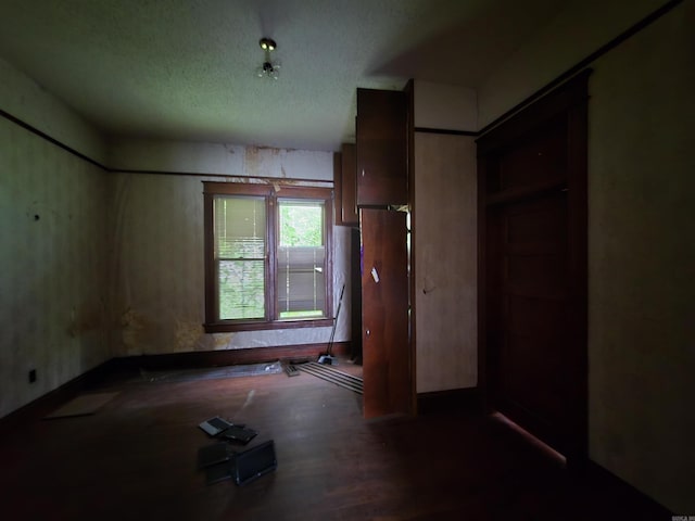 1609 W Charles Bussey Ave, Little Rock, AR 72202 - unfurnished bedroom with a textured ceiling
