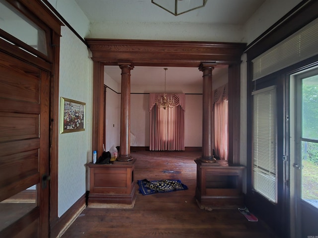 1609 W Charles Bussey Ave, Little Rock, AR 72202 - corridor with decorative columns, a chandelier, and wood finished floors