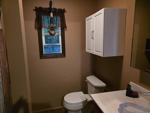 249 Mud Cat Rd, Heber Springs, AR 72543 - bathroom featuring toilet, vanity, and tile patterned flooring