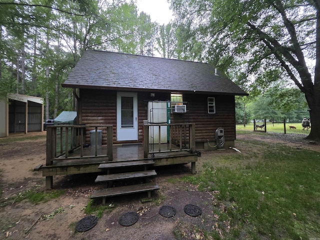 249 Mud Cat Rd, Heber Springs, AR 72543 - rear view of house featuring log veneer siding and roof with shingles
