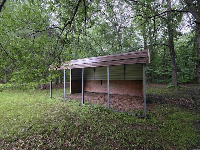 249 Mud Cat Rd, Heber Springs, AR 72543 - view of outdoor structure with a view of trees and a detached carport