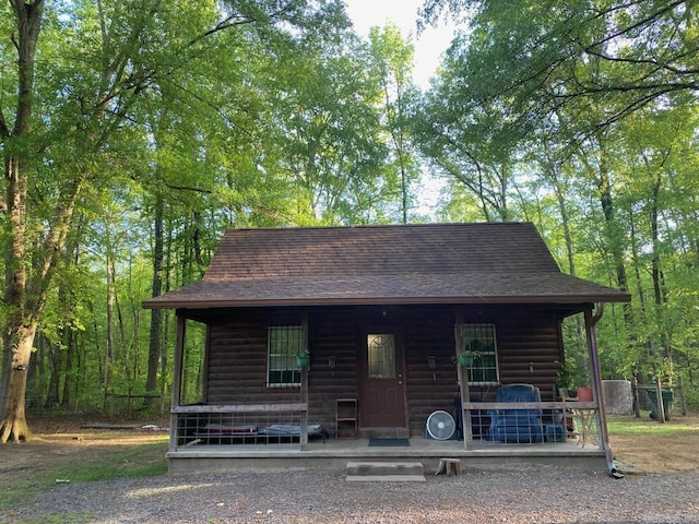249 Mud Cat Rd, Heber Springs, AR 72543 - view of front of home with faux log siding, a shingled roof, and a porch