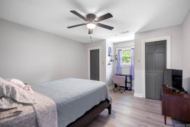 55 Laver Cir, Little Rock, AR 72210 - bedroom with light wood finished floors, baseboards, and ceiling fan
