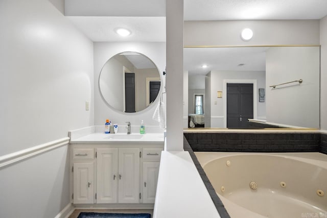 55 Laver Cir, Little Rock, AR 72210 - full bath with vanity, a jetted tub, and baseboards
