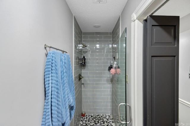 55 Laver Cir, Little Rock, AR 72210 - bathroom with a stall shower and a textured ceiling