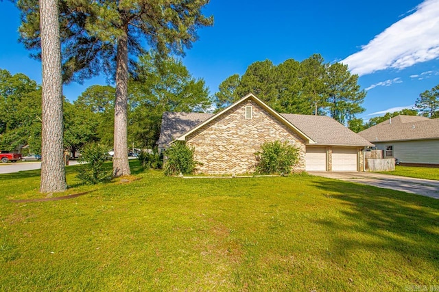 55 Laver Cir, Little Rock, AR 72210 - view of front of house with driveway, an attached garage, brick siding, and a front lawn