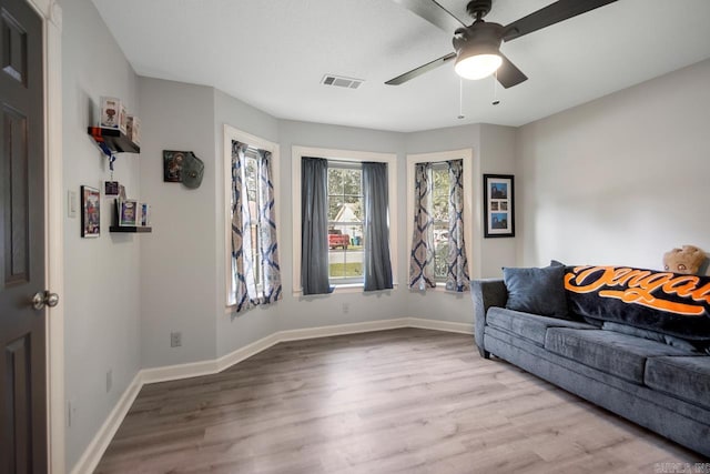 55 Laver Cir, Little Rock, AR 72210 - living area featuring a ceiling fan, wood finished floors, and baseboards