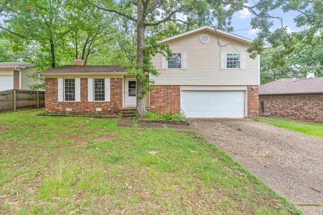 104 Heatherbrae Ct, Sherwood, AR 72120 - tri-level home with driveway, an attached garage, brick siding, and a chimney