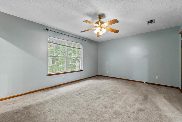 104 Heatherbrae Ct, Sherwood, AR 72120 - spare room featuring carpet flooring, ceiling fan, baseboards, and a textured ceiling