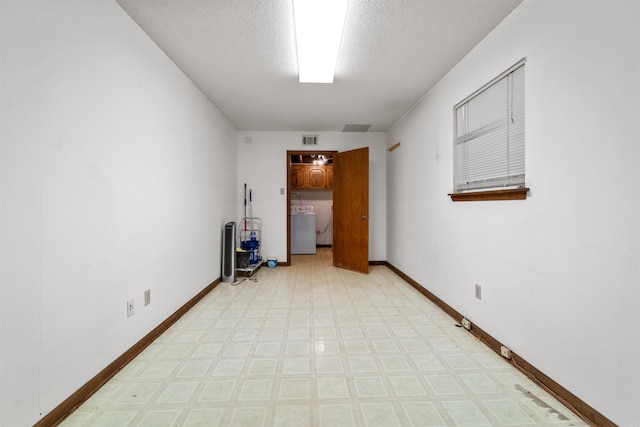 104 Heatherbrae Ct, Sherwood, AR 72120 - spare room featuring light floors, baseboards, and a textured ceiling