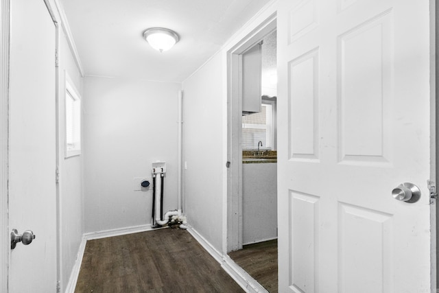 713 Hyacinth St, North Little Rock, AR 72117 - laundry area featuring electric dryer hookup, dark wood-type flooring, plenty of natural light, and baseboards