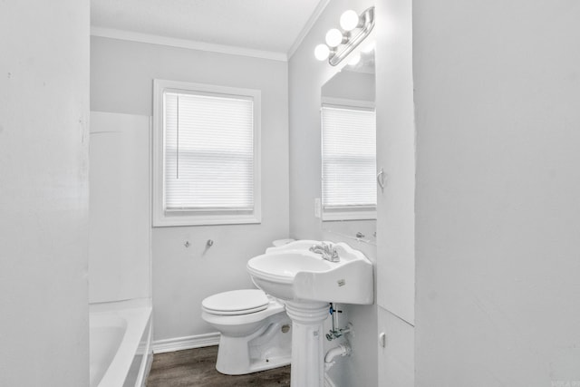 713 Hyacinth St, North Little Rock, AR 72117 - full bath featuring toilet, wood finished floors, crown molding, and baseboards