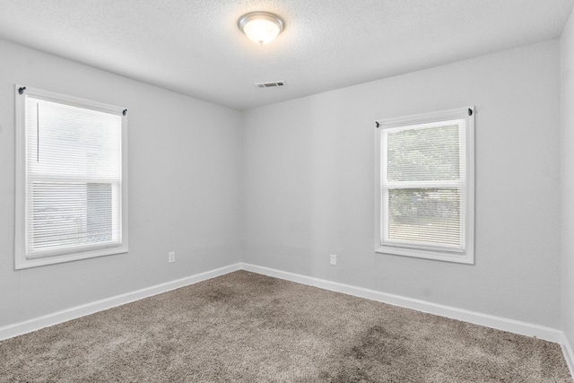 713 Hyacinth St, North Little Rock, AR 72117 - spare room with carpet floors, a textured ceiling, and baseboards