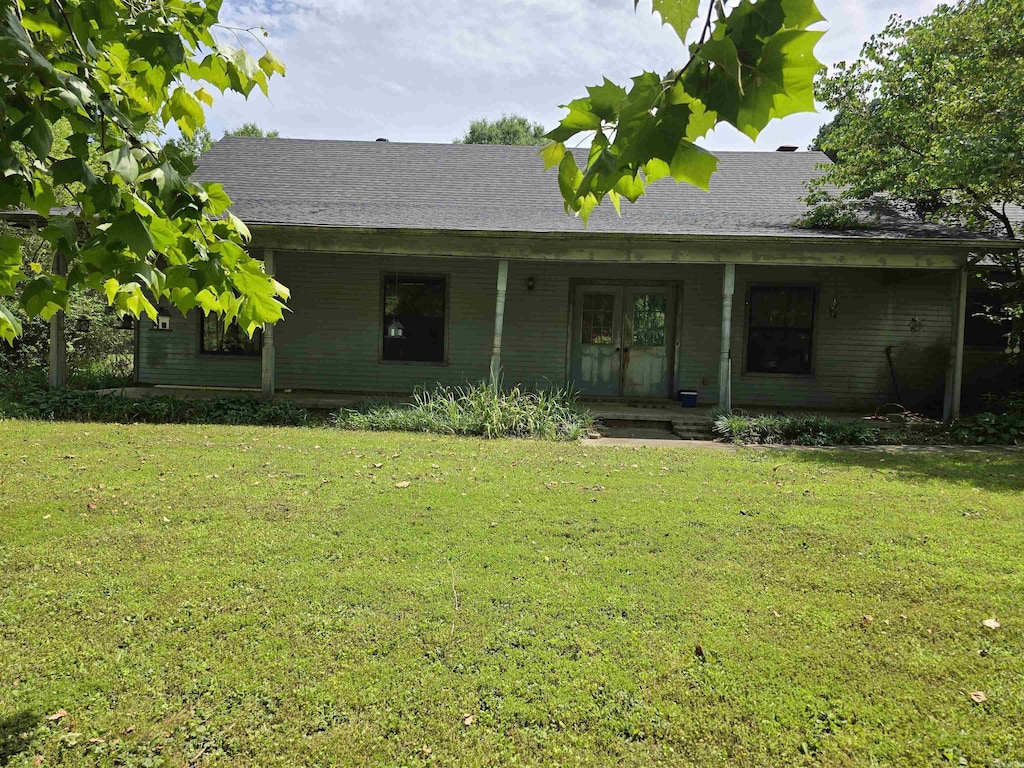 81 Harvest Ln, Austin, AR 72007 - view of front facade with a front lawn, french doors, and a porch