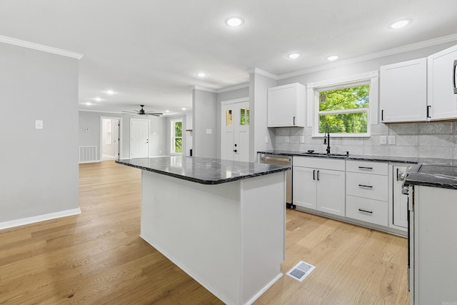 912 Bumpus Rd, Alexander, AR 72002 - kitchen with a sink, stainless steel dishwasher, crown molding, a ceiling fan, and recessed lighting