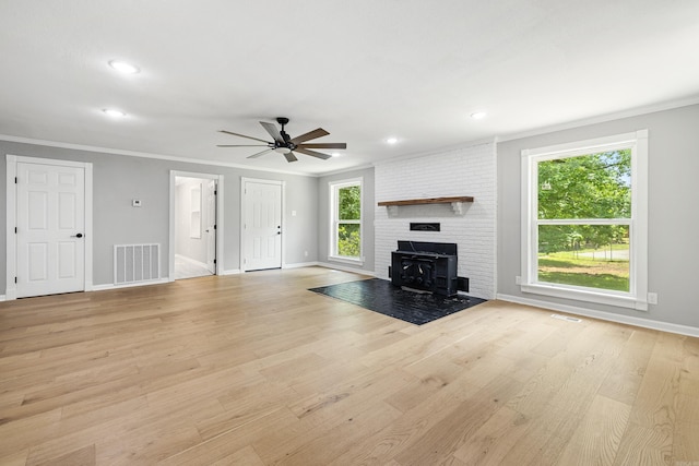 912 Bumpus Rd, Alexander, AR 72002 - unfurnished living room featuring baseboards, crown molding, ceiling fan, light wood finished floors, and recessed lighting