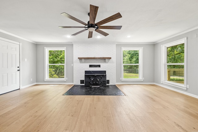 912 Bumpus Rd, Alexander, AR 72002 - unfurnished living room with crown molding, healthy amount of natural light, a ceiling fan, wood finished floors, and baseboards