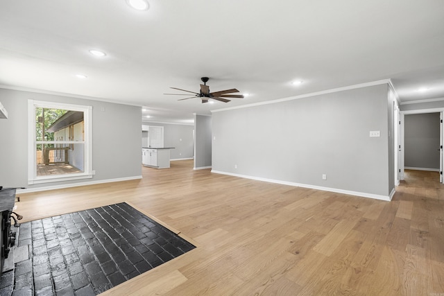 912 Bumpus Rd, Alexander, AR 72002 - unfurnished living room with a ceiling fan, recessed lighting, crown molding, light wood-type flooring, and baseboards