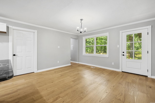 912 Bumpus Rd, Alexander, AR 72002 - unfurnished living room featuring a chandelier, crown molding, baseboards, and light wood-type flooring