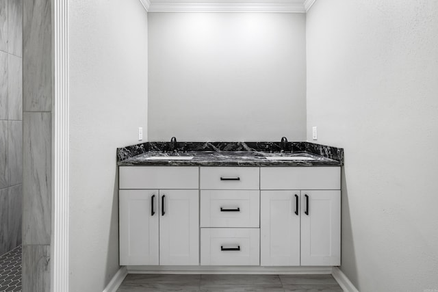 912 Bumpus Rd, Alexander, AR 72002 - full bathroom featuring marble look tile flooring, ornamental molding, double vanity, baseboards, and a tile shower