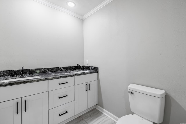 912 Bumpus Rd, Alexander, AR 72002 - bathroom with ornamental molding, marble look tile flooring, double vanity, toilet, and baseboards