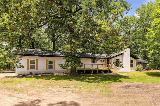 912 Bumpus Rd, Alexander, AR 72002 - back of house featuring a lawn, a deck, and view of scattered trees