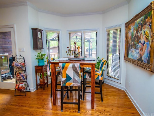 22405 Denny Rd, Little Rock, AR 72223 - dining space with light wood-style floors, crown molding, and baseboards