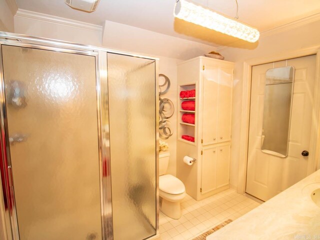 22405 Denny Rd, Little Rock, AR 72223 - full bath featuring ornamental molding, a stall shower, tile patterned flooring, toilet, and vanity