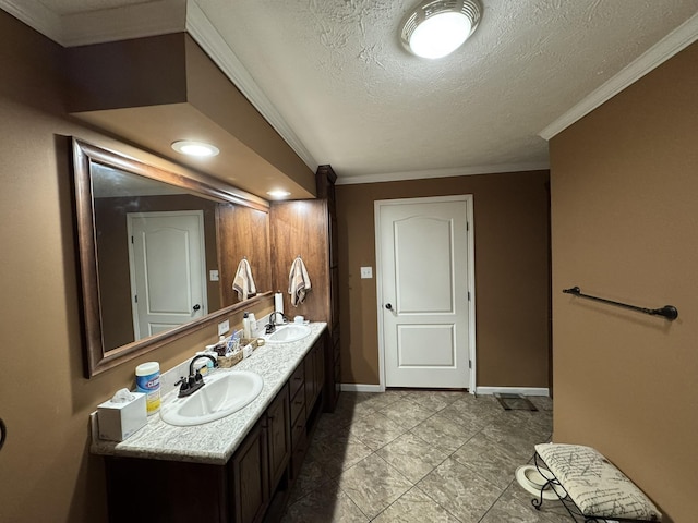 684 Cotter Rd, Gassville, AR 72635 - bathroom featuring double vanity, baseboards, a textured ceiling, and crown molding