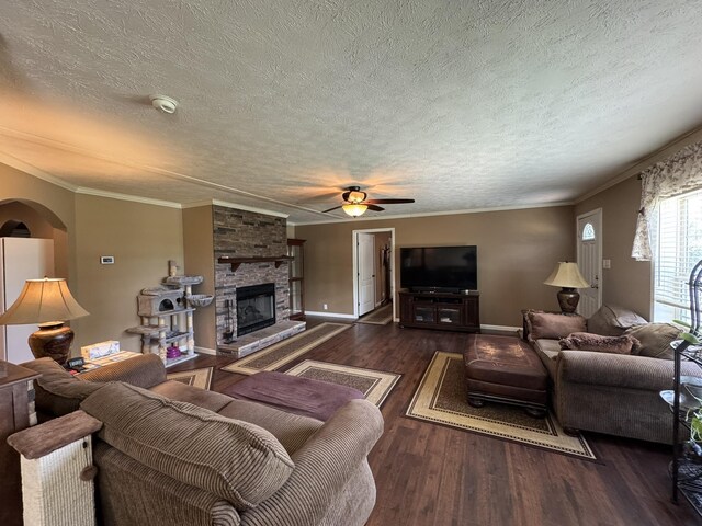 684 Cotter Rd, Gassville, AR 72635 - living area with a textured ceiling, wood finished floors, ornamental molding, a ceiling fan, and baseboards
