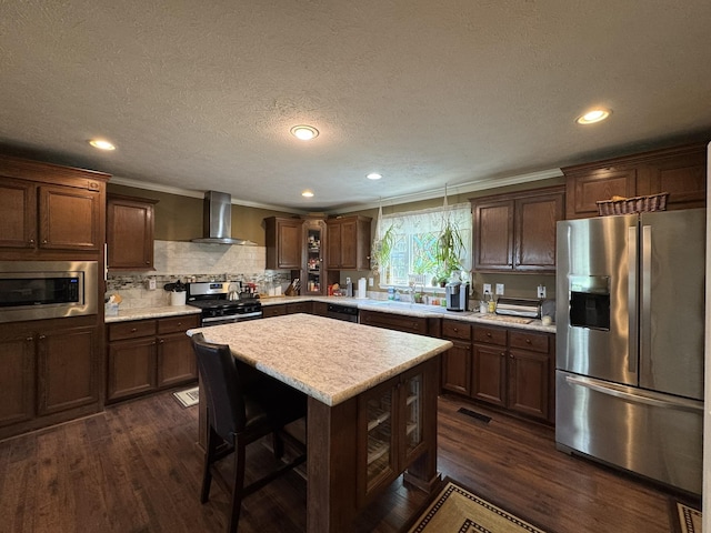 684 Cotter Rd, Gassville, AR 72635 - kitchen featuring appliances with stainless steel finishes, wall chimney range hood, dark wood-style floors, light countertops, and crown molding