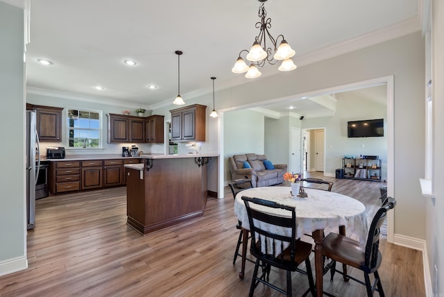 118 Caroline Loop, Plumerville, AR 72127 - dining area featuring light wood-style floors, baseboards, ornamental molding, a chandelier, and recessed lighting