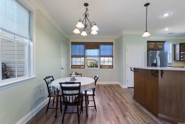 118 Caroline Loop, Plumerville, AR 72127 - dining room with dark wood finished floors, a chandelier, crown molding, baseboards, and recessed lighting
