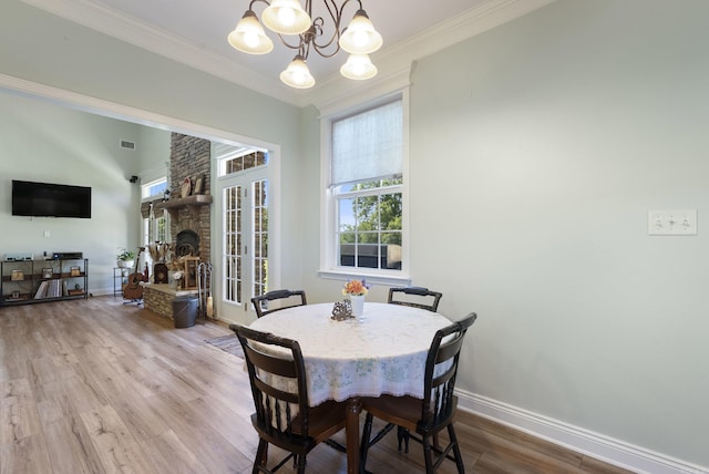 118 Caroline Loop, Plumerville, AR 72127 - dining area featuring a chandelier, wood finished floors, crown molding, and baseboards