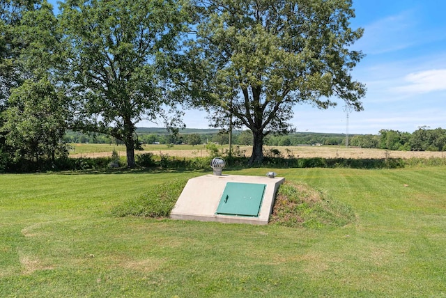 118 Caroline Loop, Plumerville, AR 72127 - view of storm shelter featuring a lawn and a view of rural / pastoral area