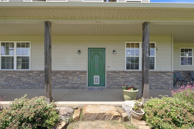 118 Caroline Loop, Plumerville, AR 72127 - entrance to property featuring covered porch and stone siding