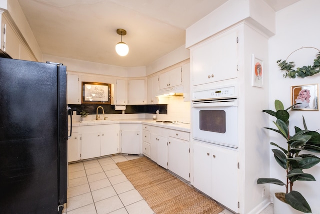 4500 Glenmere Rd, North Little Rock, AR 72116 - kitchen featuring white appliances, backsplash, a sink, light countertops, and light tile patterned floors